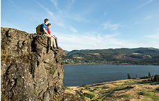 Couples sitting on hilltop